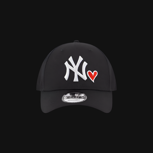 Black cap with white logo and red heart on a black background